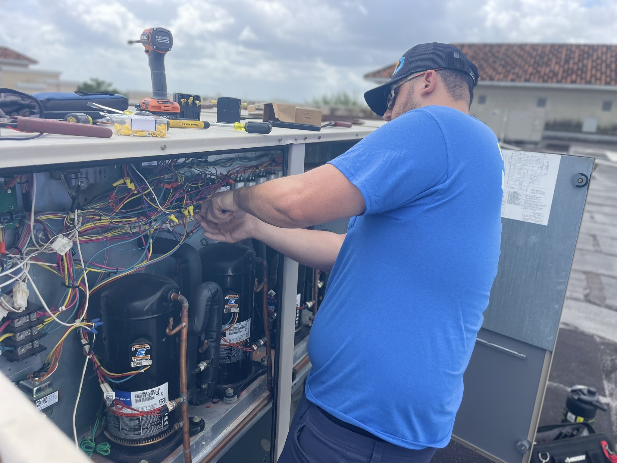 CoolWave technician servicing a commercial refrigeration unit